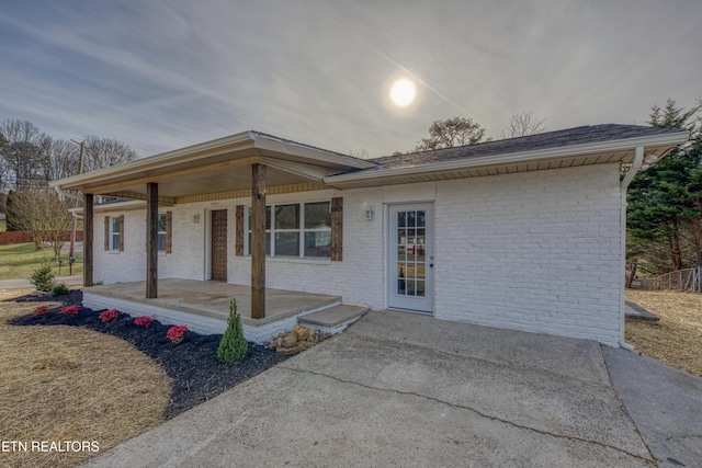 view of front of house with a porch and a patio area