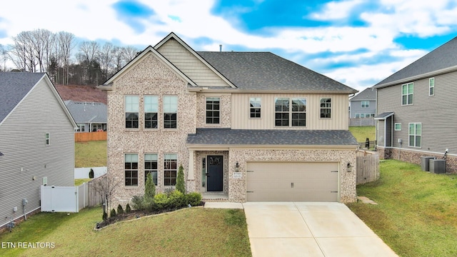 craftsman-style house featuring a front yard and a garage