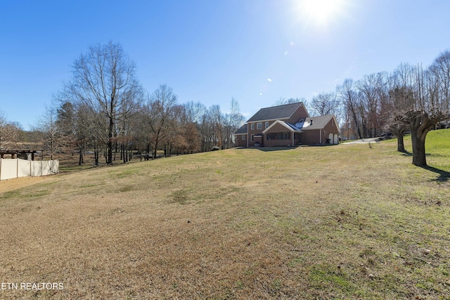 view of yard featuring fence