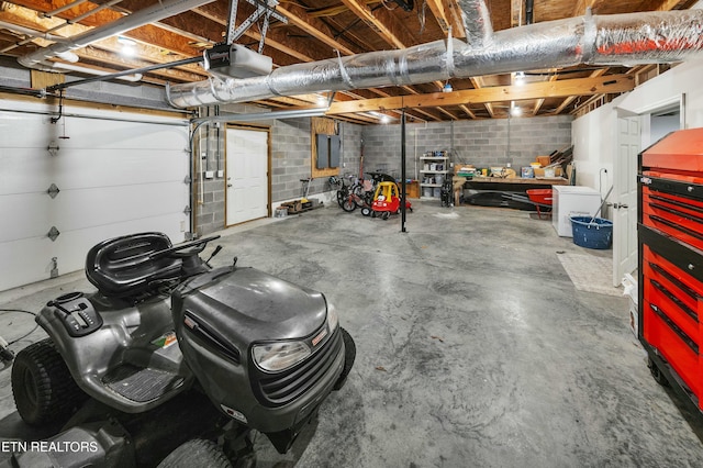 garage featuring a garage door opener and electric panel