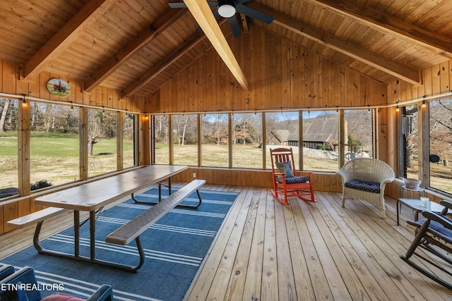 sunroom featuring wooden ceiling, vaulted ceiling with beams, and ceiling fan