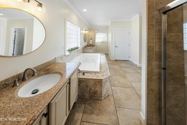 bathroom with tile patterned flooring, crown molding, a bath, and vanity