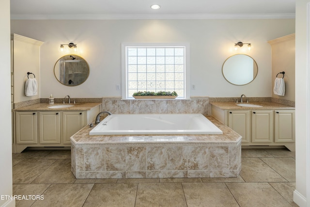 full bathroom featuring crown molding, two vanities, and a sink