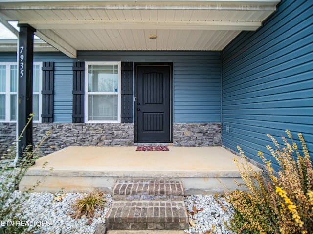 property entrance featuring covered porch