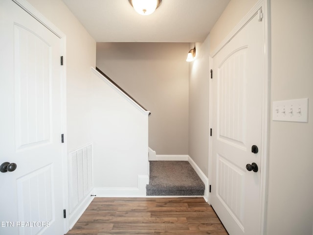 stairway featuring hardwood / wood-style flooring