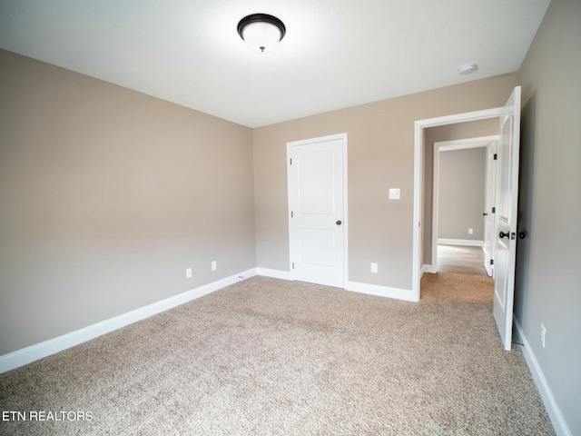 unfurnished bedroom with light colored carpet