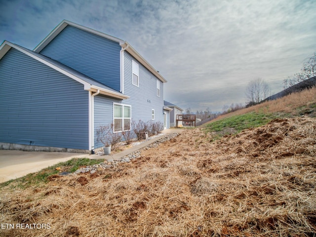 view of side of property with a garage