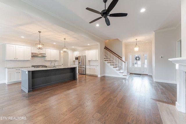 282 Chimney Rock Dr, Lenoir City, TN 37771 - kitchen with white cabinets, dark wood-style flooring, appliances with stainless steel finishes, and under cabinet range hood
