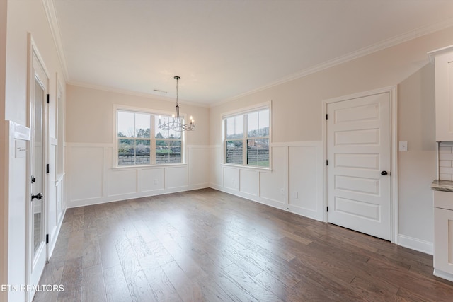 282 Chimney Rock Dr, Lenoir City, TN 37771 - unfurnished dining area with dark wood finished floors, crown molding, a wainscoted wall, and a chandelier