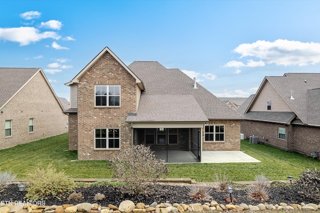 282 Chimney Rock Dr, Lenoir City, TN 37771 - rear view of property with a patio, brick siding, a lawn, and central AC
