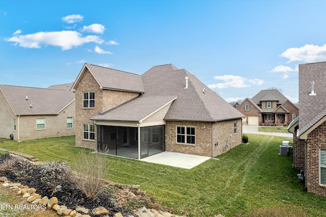282 Chimney Rock Dr, Lenoir City, TN 37771 - back of property with brick siding, a sunroom, a yard, and a patio area