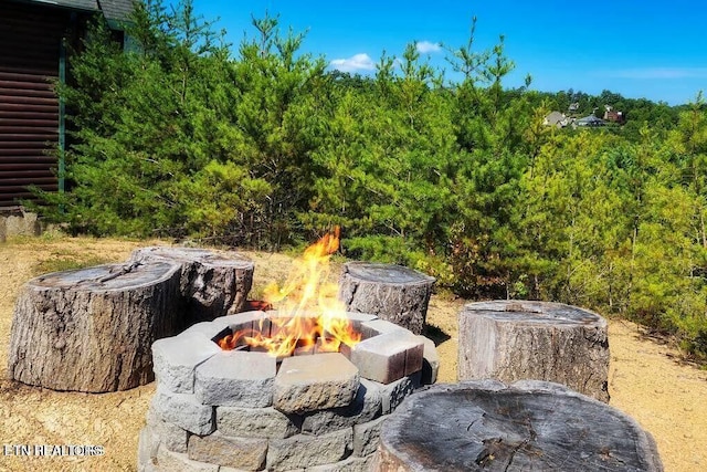 exterior space with a fire pit