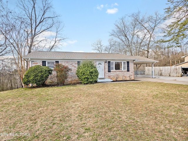 single story home with a front yard and a carport