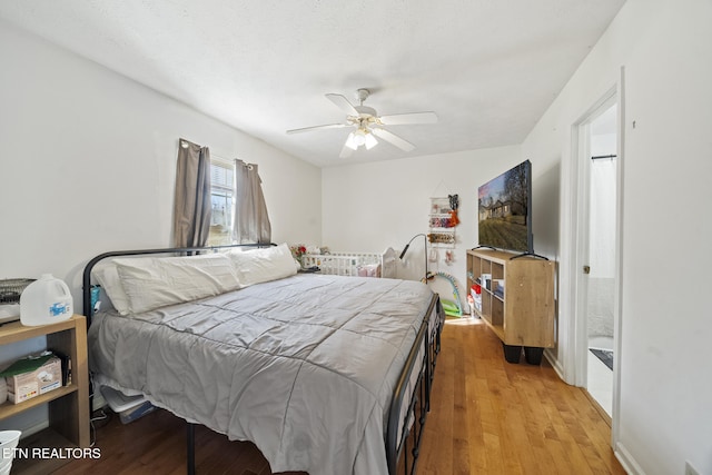 bedroom featuring a ceiling fan and light wood finished floors