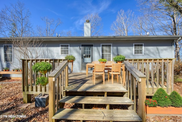 wooden deck with outdoor dining space