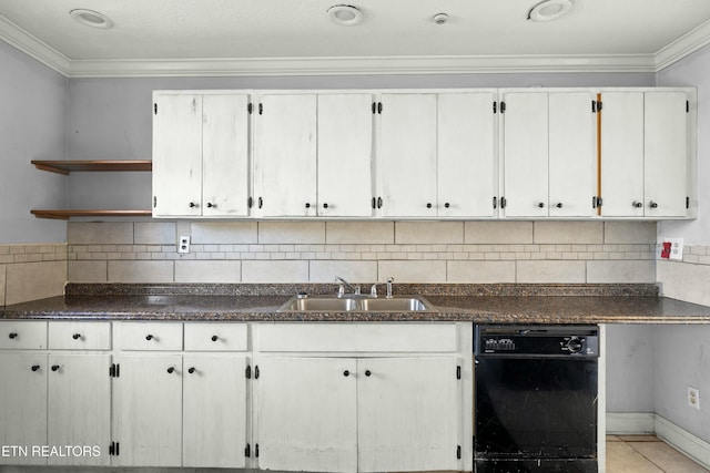 kitchen with dishwasher, dark countertops, a sink, and white cabinetry