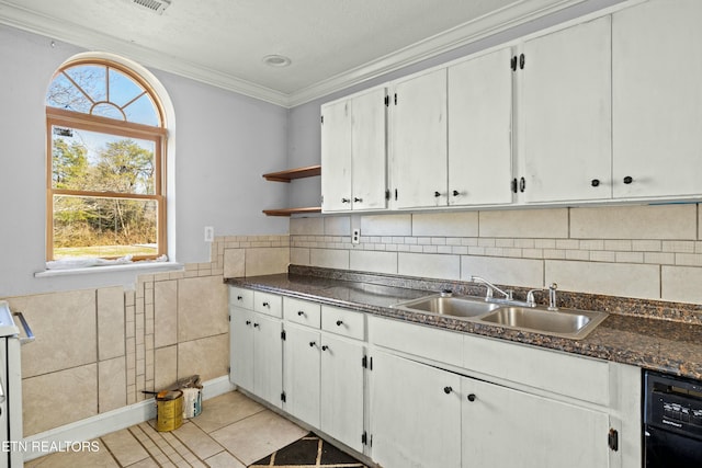 kitchen featuring open shelves, dark countertops, white cabinetry, a sink, and dishwasher