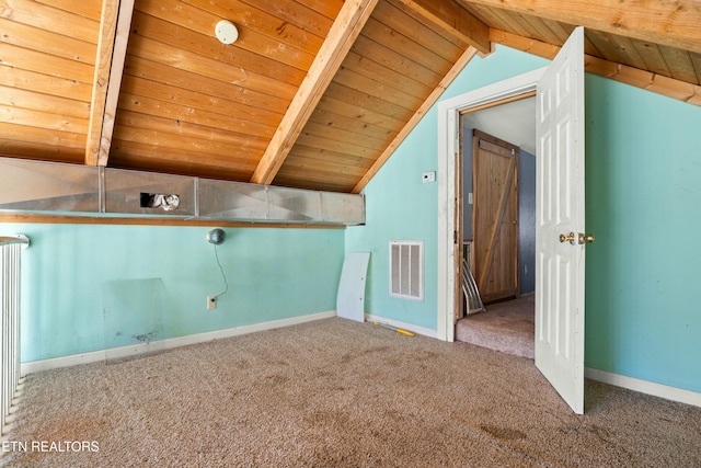 bonus room with carpet flooring, vaulted ceiling with beams, visible vents, and baseboards