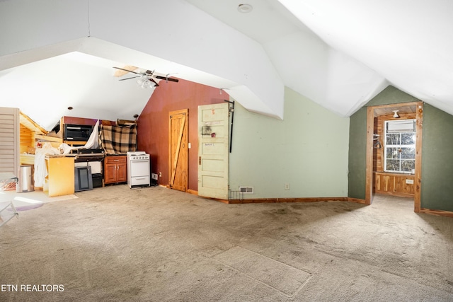 additional living space featuring lofted ceiling, ceiling fan, carpet, and baseboards