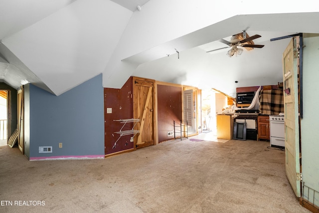 additional living space with lofted ceiling, ceiling fan, light carpet, and visible vents