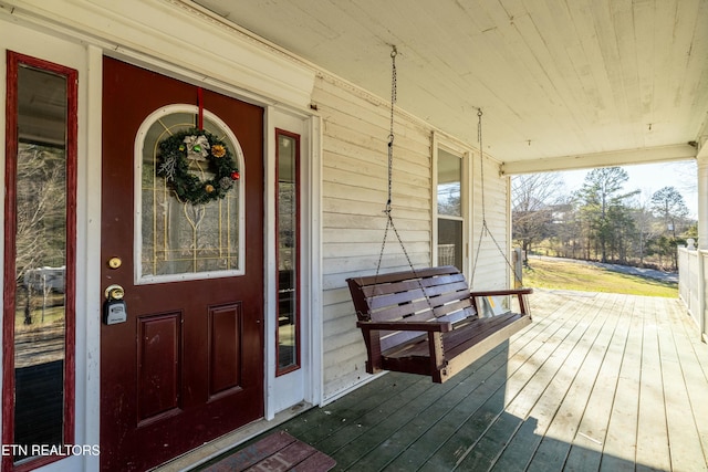 doorway to property with covered porch