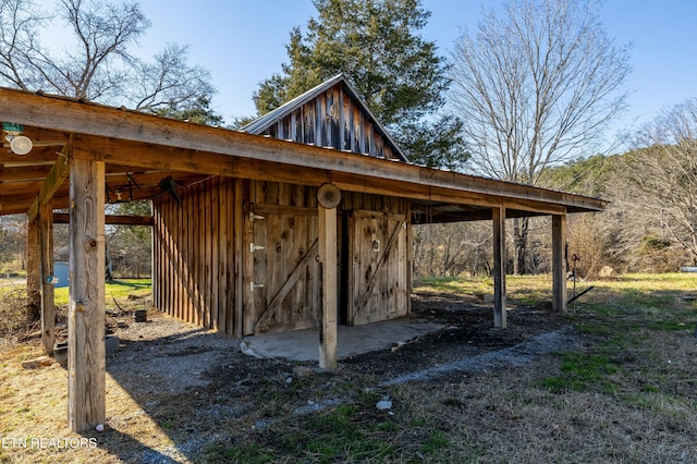 view of home's community with a carport and an outbuilding