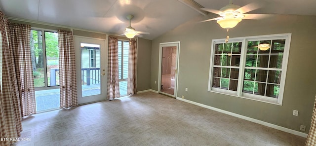 carpeted spare room featuring ceiling fan and lofted ceiling with beams