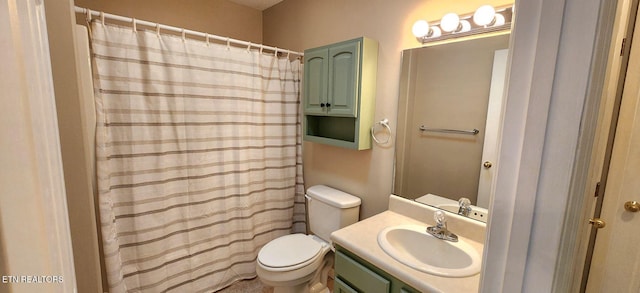 bathroom with vanity, toilet, and walk in shower