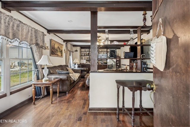 living room with hardwood / wood-style flooring and beamed ceiling