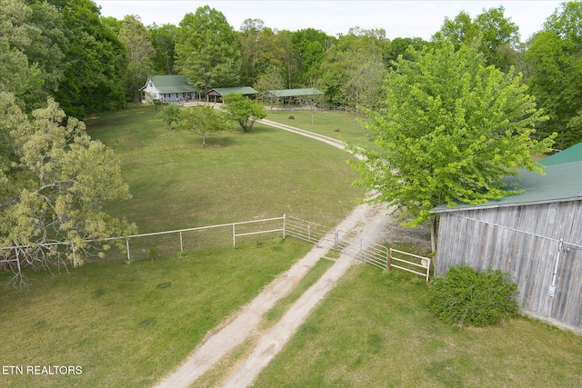 birds eye view of property with a rural view