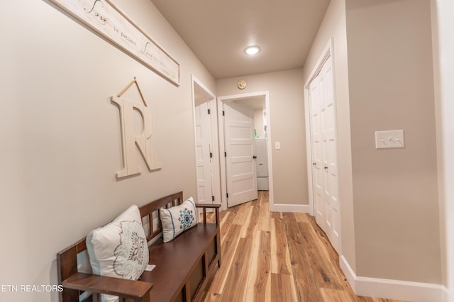 corridor with light wood-type flooring