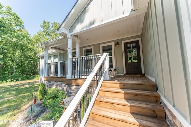 doorway to property featuring a porch