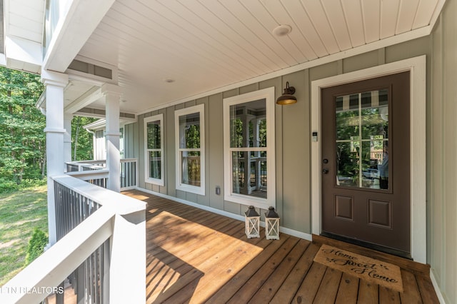 view of exterior entry featuring a porch