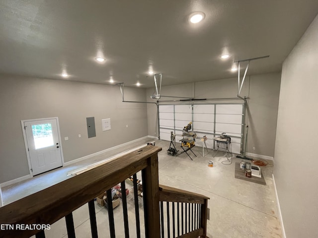 garage featuring a garage door opener and electric panel