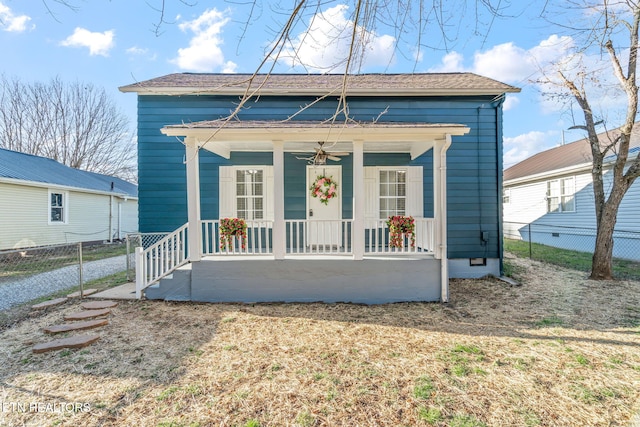 view of front facade with a porch, crawl space, fence, and a ceiling fan