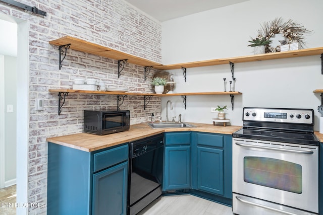 kitchen featuring blue cabinets, black appliances, butcher block counters, and open shelves