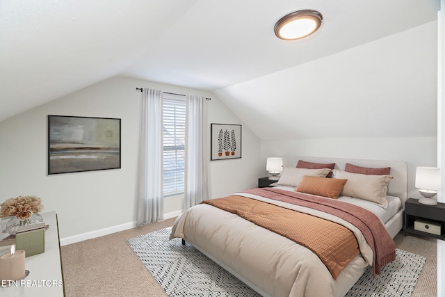 bedroom featuring light carpet, baseboards, and lofted ceiling