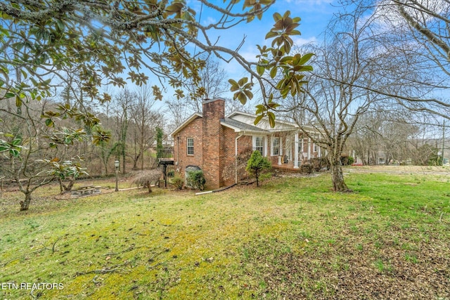 view of property exterior with a yard