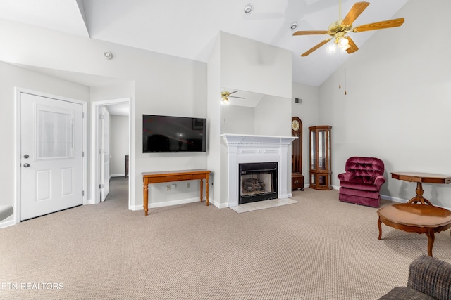 carpeted living room with high vaulted ceiling and ceiling fan