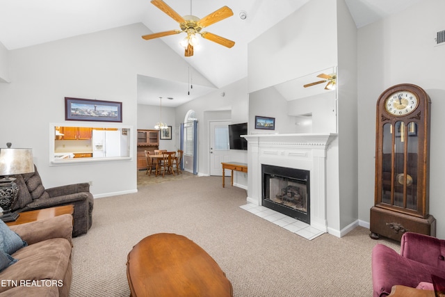 carpeted living room featuring high vaulted ceiling and ceiling fan