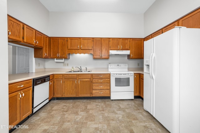 kitchen featuring white appliances and sink