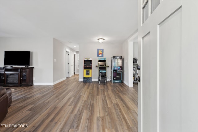 living room with wood finished floors and baseboards