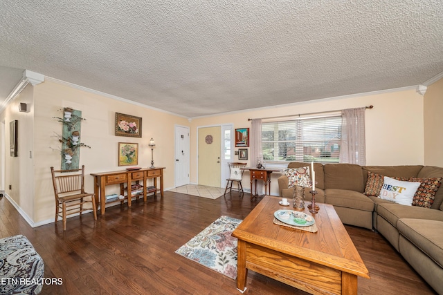 living room with a textured ceiling, hardwood / wood-style flooring, and crown molding