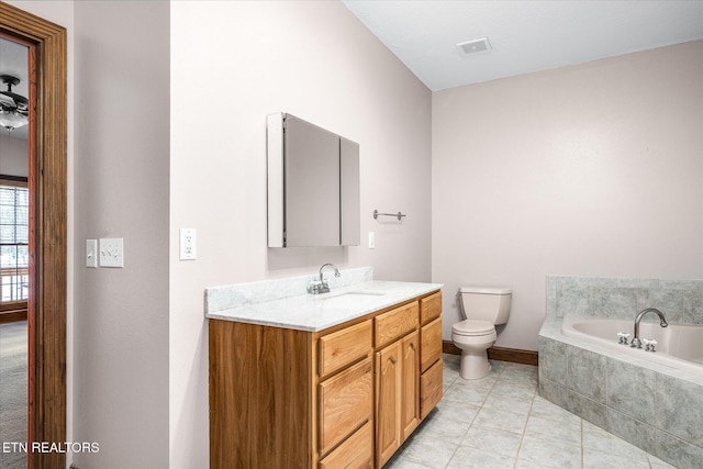 full bathroom featuring a garden tub, visible vents, toilet, vanity, and tile patterned flooring