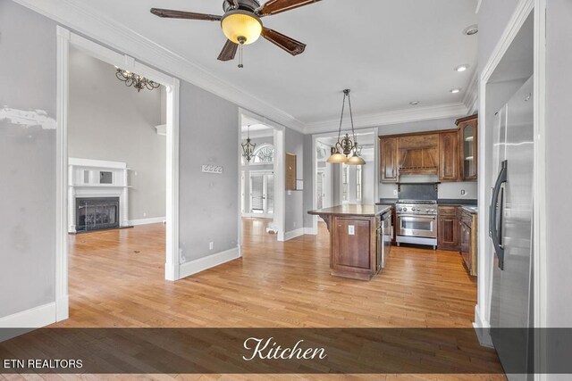 kitchen featuring stainless steel range, dark countertops, a breakfast bar, brown cabinets, and a center island