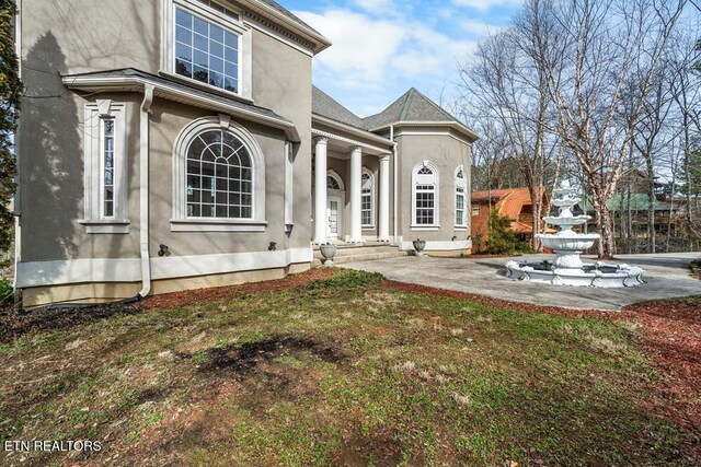 exterior space featuring stucco siding