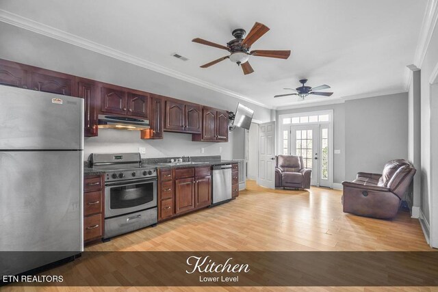 kitchen featuring under cabinet range hood, visible vents, open floor plan, appliances with stainless steel finishes, and dark countertops