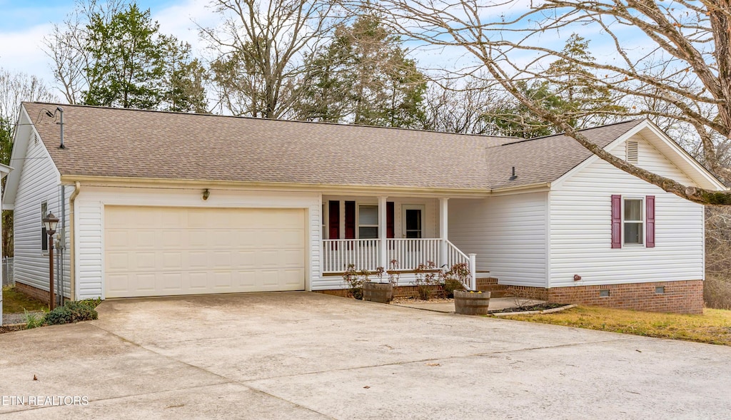 ranch-style home with crawl space, driveway, roof with shingles, covered porch, and an attached garage