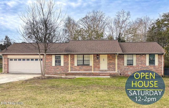 single story home with a front yard and a garage