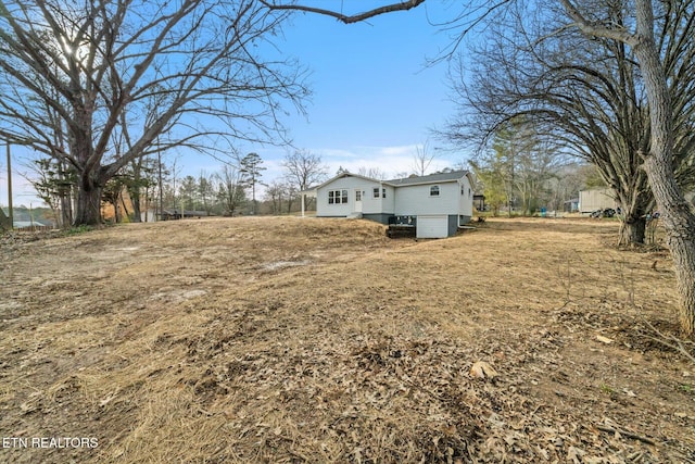 view of yard featuring a garage